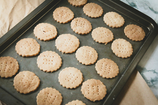 Homemade crackers on black baking tray
