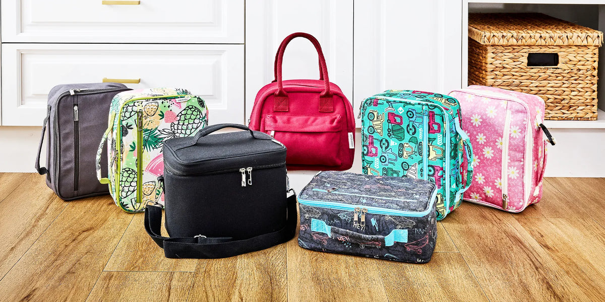 colourful insulated lunch bags stacked on wooden floor