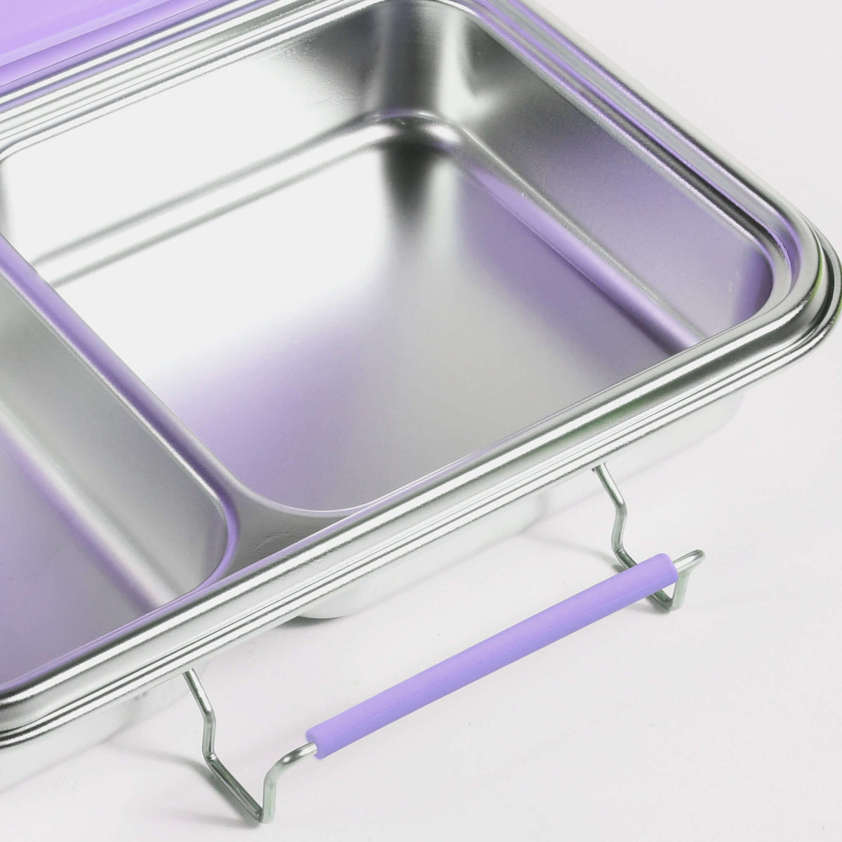 Lilac replacement latch fitted to the side of a two-compartment stainless steel bento box