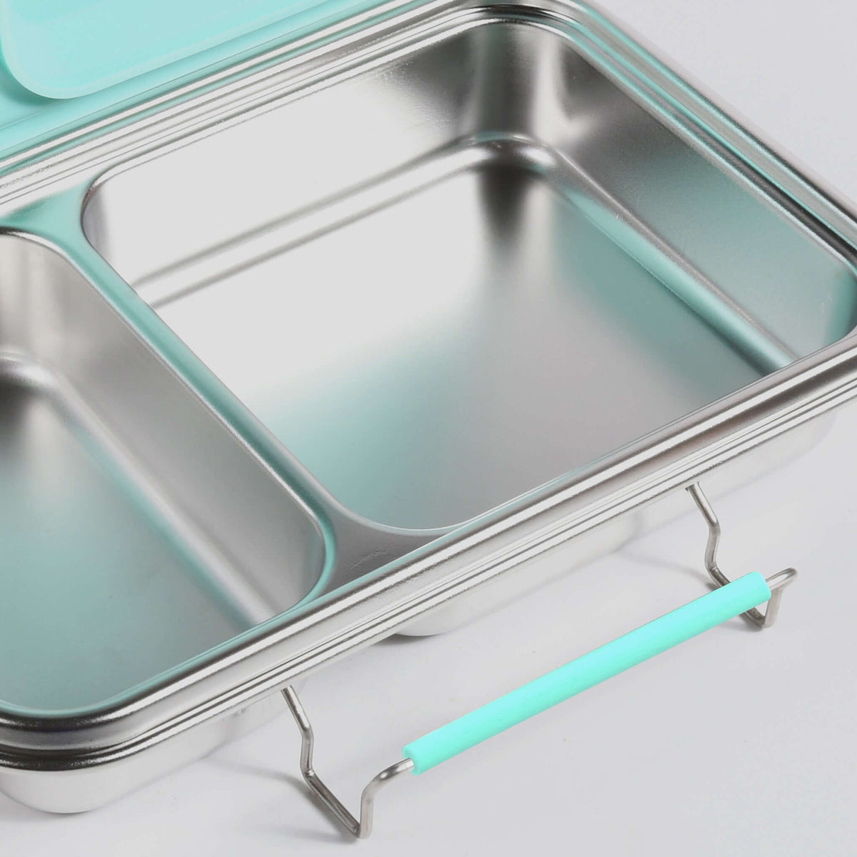 Aqua replacement latch fitted to the side of a two-compartment stainless steel bento box