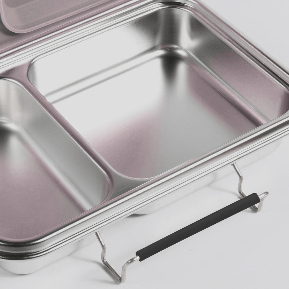 Black replacement latch fitted to the side of a two-compartment stainless steel bento box