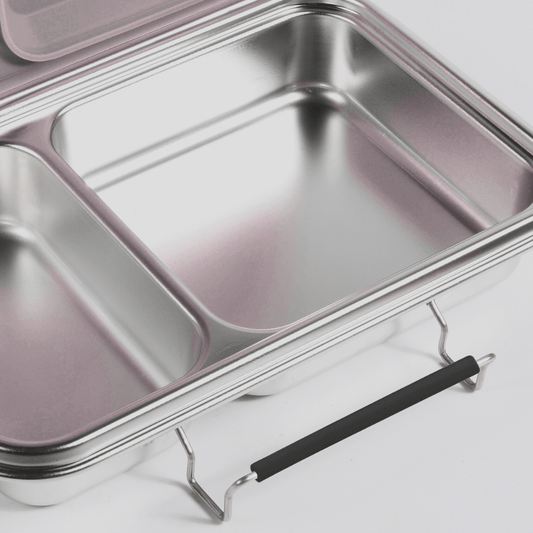 Black replacement latch fitted to the side of a two-compartment stainless steel bento box