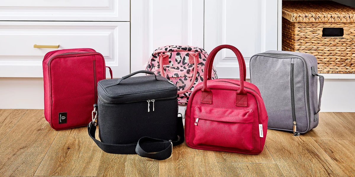 red and other coloured lunch bags placed on wooden floor
