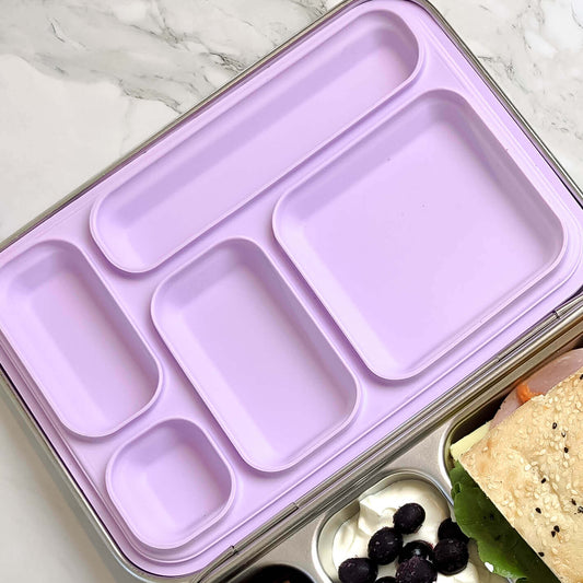 Lilac replacement silicone seal seated in a five-compartment stainless steel bento lid